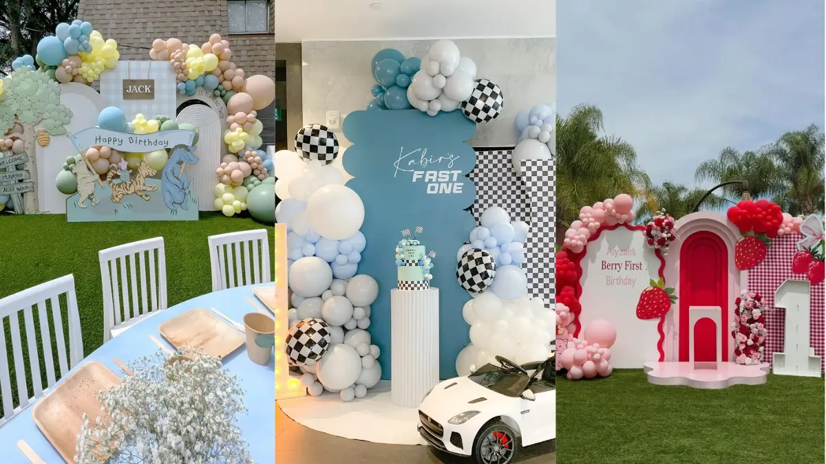 First birthday party themes with a styled cake table and balloon backdrop