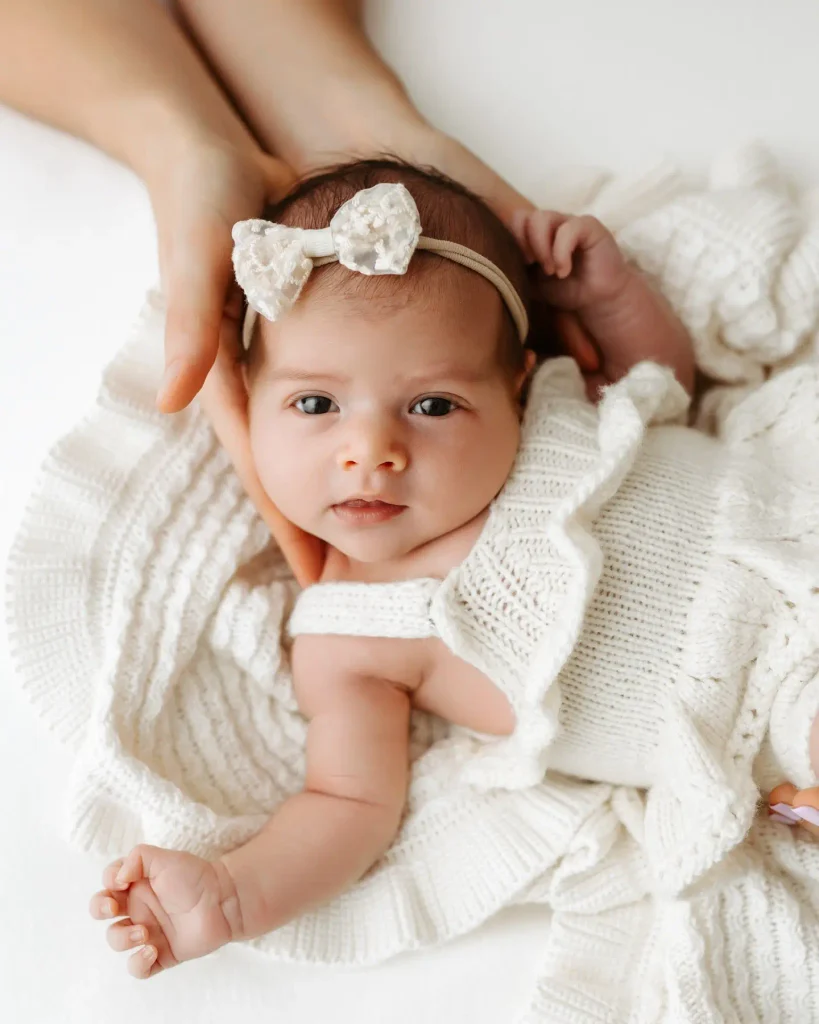 Soft Overhead Shot With a Parent's Hands Cradling the Face