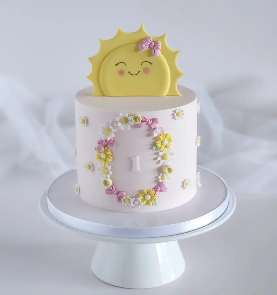A Little Sunshine Cake With a Flower Wreath Around the Number
