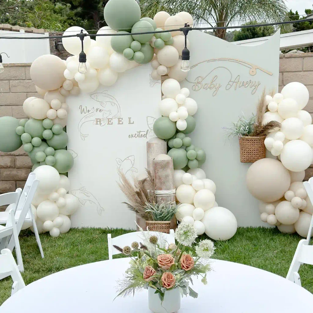 Reel excited fishing baby shower with line drawings, sage balloons and pampas grass