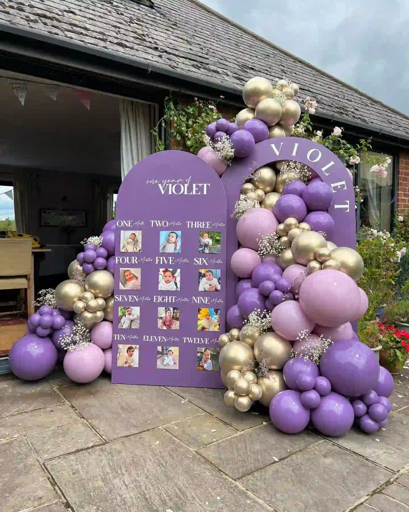 Hang a Month by Month Photo Board Beside the Balloon Arch