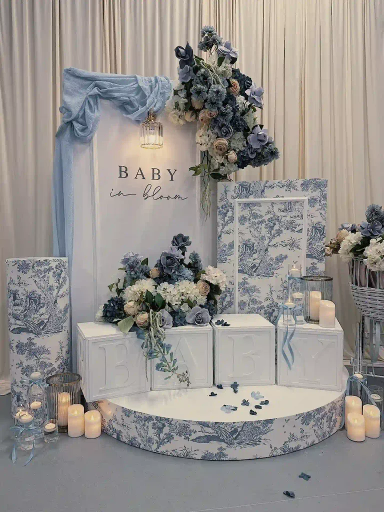 Candles, Ribbons and Blue Flowers Make a Quiet, Elegant Welcome